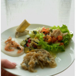 antipasto di pesce sarde in saor, schiee con polenta baccalà mantecato e insalata di mare